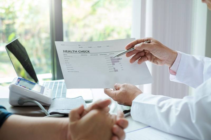 A Harding Medical Institute provider reviewing a personalized plan with a member