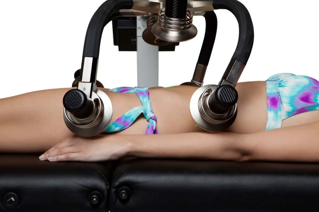 Close-up of two Zerona Z6 laser heads positioned over the hip and thigh